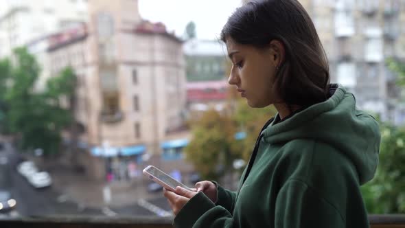 Upset Woman Holding Cellphone Disgusted with Message