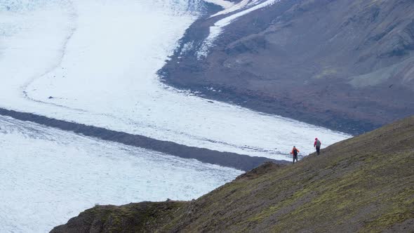 Tourists Travel in the Mountains of Iceland