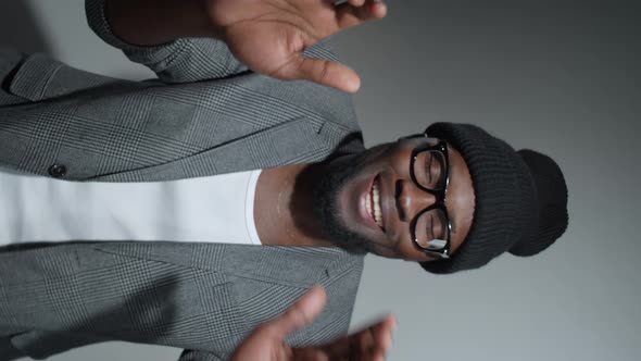 Hipster Black Man Smiling and Dancing in Studio