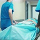 Medical stuff moving gurney with patient - VideoHive Item for Sale