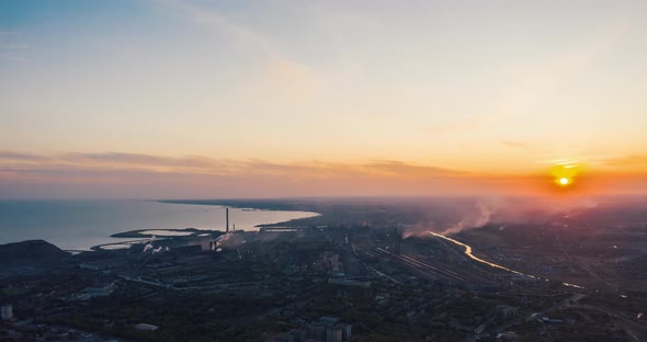 Industrial City in Summer. On the Horizon, a Metallurgical Plant Near the Sea