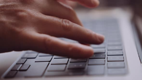 Closeup of Womans Hands Typing on a Laptop While Going By Train