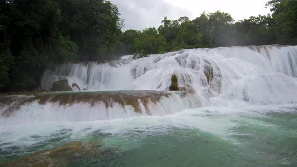 Sideways panning revealing all the beauty of Agua Azul waterfalls