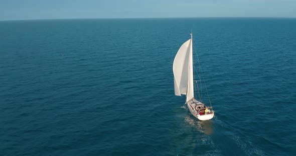 Sun Yachts with White Sails in Open Sea Aerial