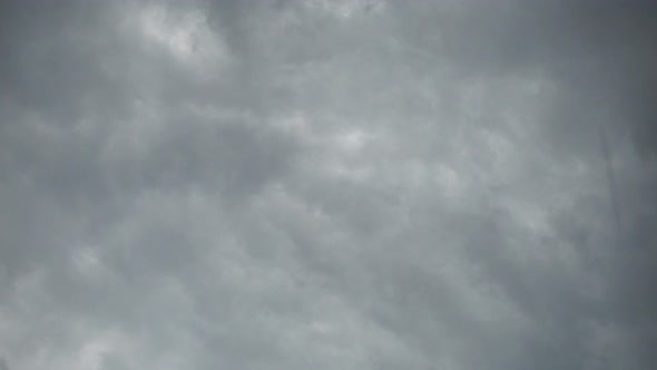 Real Time Flying Amazing Grey Rain Clouds and Rain Drops Falling Down..