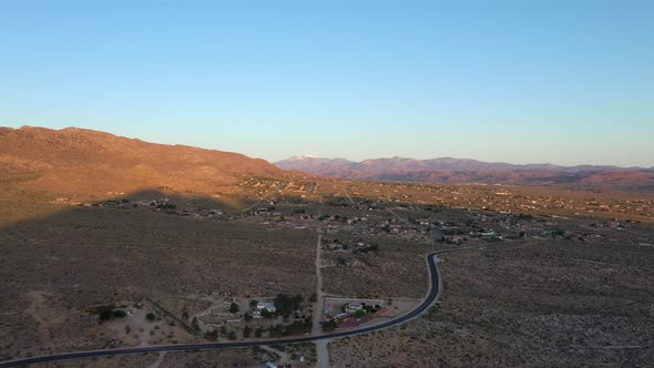 Asphalt Road Leading To St. George City Community At Daytime In Utah, USA. - aerial