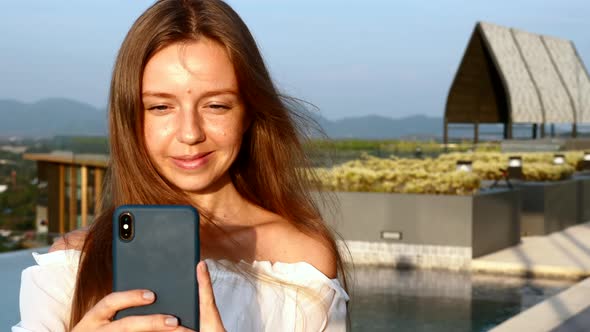 Young Smiling Woman with Smartphone Making Video or Stories for Social Network