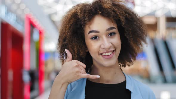 Female Portrait Indoors Happiness Contented African American Curly Woman Girl Showing Direction to