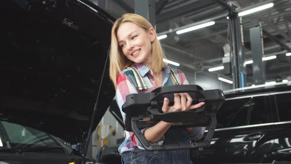 Good Looking Woman in Uniform Writing Something on a Computer