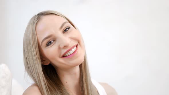 Closeup Portrait of Sexy Smiling Beautiful Woman Flirting and Touching Hair By Hand