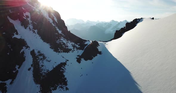 A Large Group of Climbers Climb To the Top