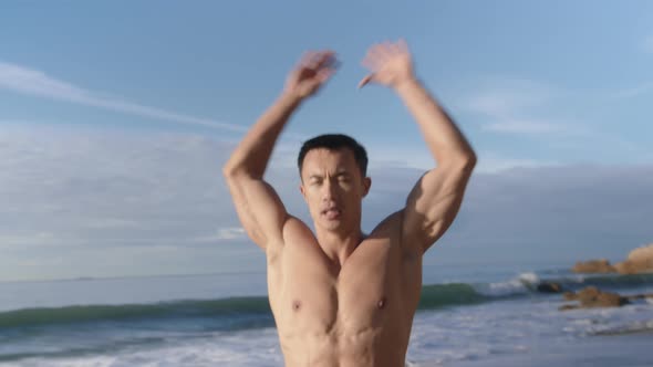 Fit Athletic Young Asian Man Workout on LA Beach