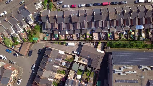 Rows of identical houses in suburban neighborhood, Exeter, UK, Aerial Zoom Out