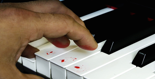 Playing with Blood Fingers on Piano Keys