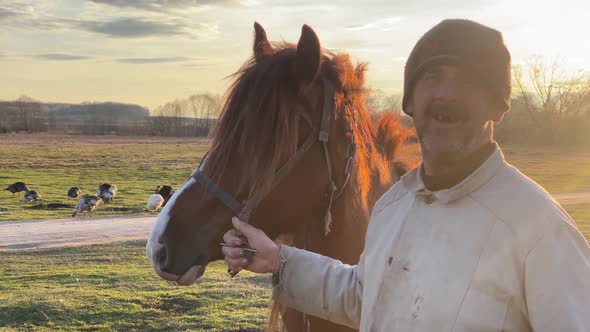 Owner showcases horse smiling and holding animal by rig