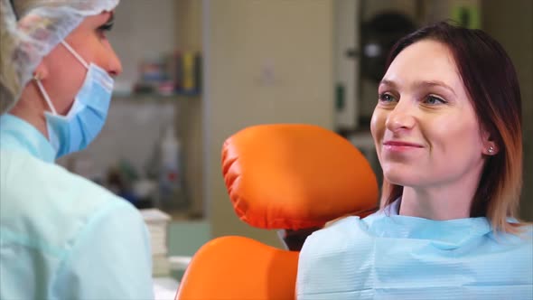 Happy Female Patient in Dental Cabinet