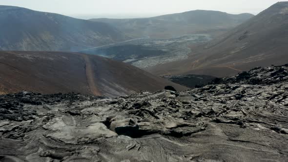 Forwards Fly Above Rugged Surface of New Lava Field