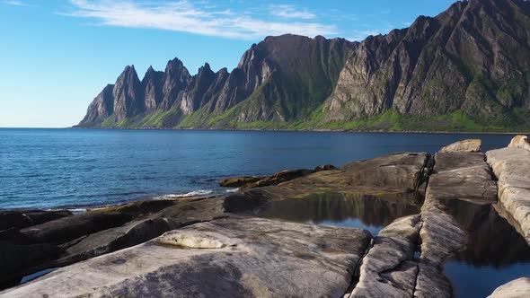 Popular travel destination and Rock Davil’s Jaw in the sunny summer day, Norway,island Senja