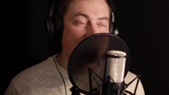 A Professional Announcer Makes a Recording in the Studio