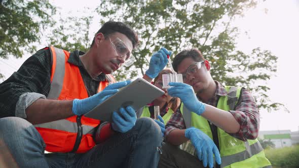 Ecologist team checks pH value of factory wastewater by Colorimetric method.