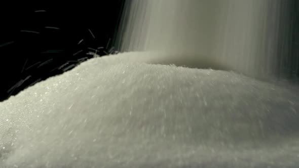 Sugar Is Poured Into Pile Closeup