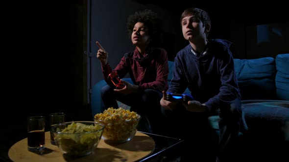 Teen Boys Watching TV Screen, Choosing Video Game