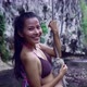 Cute Smiling and Laughing Asian Girl in Bikini on a Rope in the River Thailand - VideoHive Item for Sale