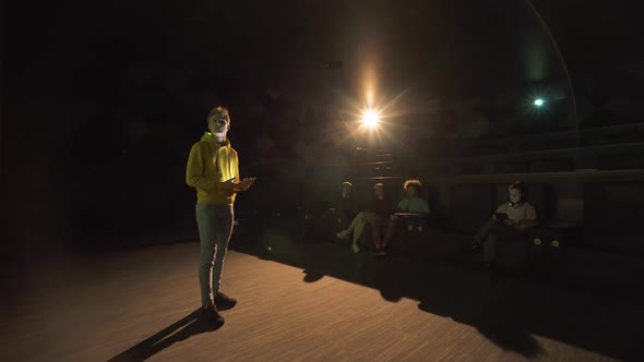 Conference in a Large Hall a Young Man Communicates with the Audience and Makes a Financial