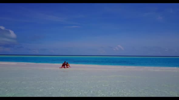 Teenage lovers in love on relaxing resort beach lifestyle by blue ocean with clean sandy background 