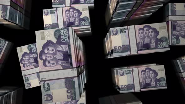 Flight over the North Korea Won money banknote packs loop animation