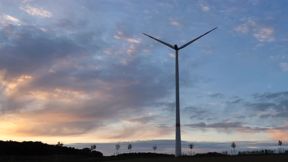 Wind turbine at sunset