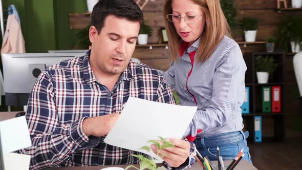 Young Businessman Giving Some Advice To One of His Subordinate