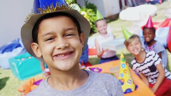 Boy making faces while friends sitting in background 4k