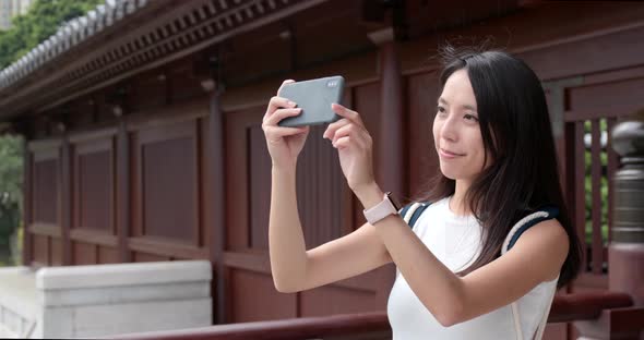 Travel woman use of mobile phone to take selfie 