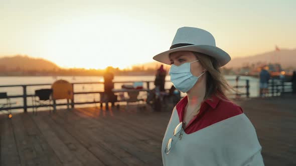 Young Beautiful Woman in Medical Mask Protecting Her Face During COVID-19, USA