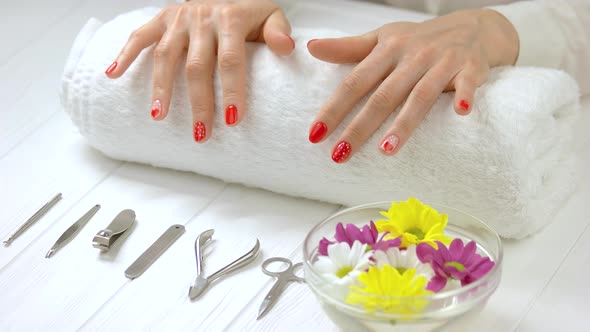 Hands with Fresh Manicure in Spa Salon.