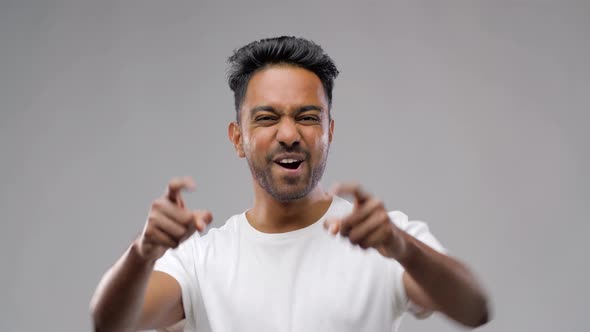 Happy Young Indian Man Celebrating Victory 