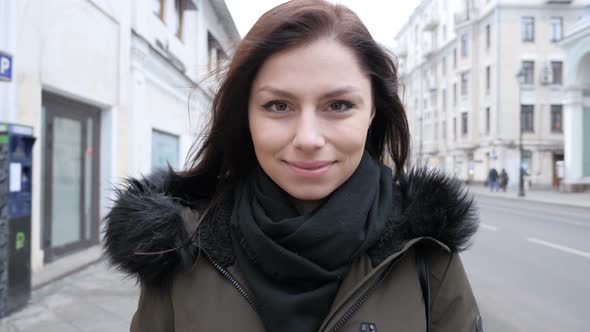 Portrait of Smiling Young Girl on Street