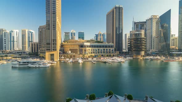 Aerial Vew of Dubai Marina with Shoping Mall Restaurants Towers and Yachts Timelapse United Arab