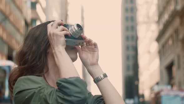 Young girl with a retro camera