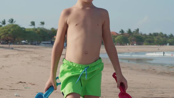 Boy Making Sand Castle