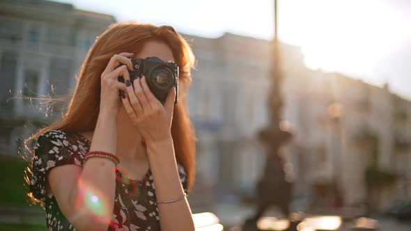 Redhead Young Beautiful Girl Looking at Photo Camera Then Shooting in Slowmotion