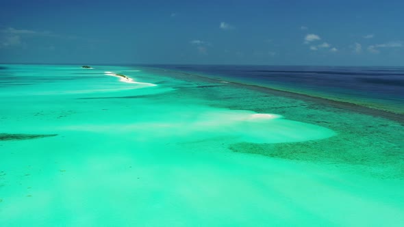 Daytime above abstract view of a white paradise beach and blue ocean background in high resolution