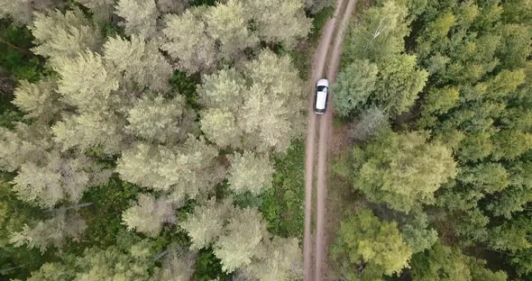 An aerial shot of a car from top