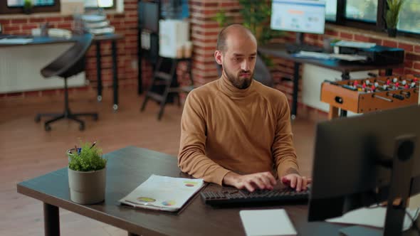 Company Accountant Analyzing Charts on Documents