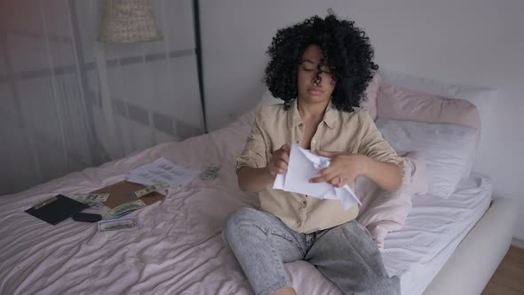 Frustrated Overwhelmed Young Woman Tearing Paper Sitting on Bed in Home Office