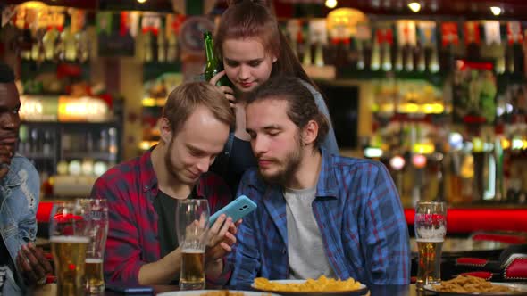 A Group of Friends Multiethnic Resting in the Bar