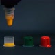 Tattoo Artist Pours Yellow Ink Into A Small Plastic Cup. - VideoHive Item for Sale