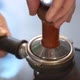 Preparing ground coffee by tamping fresh coffee. - VideoHive Item for Sale