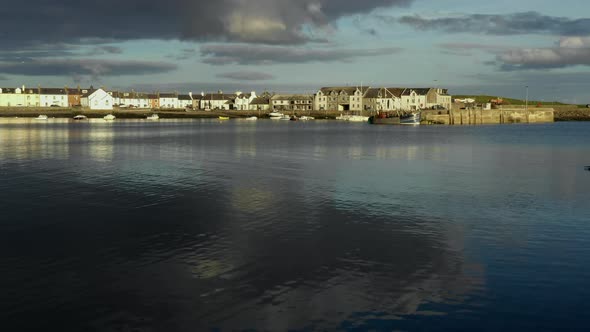A view of the small Scottish village of Isle of Whithorn in Dumfries and Galloway with small boats a